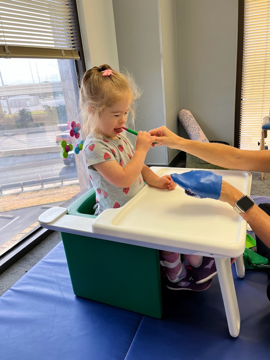 Young girl during a feeding therapy session